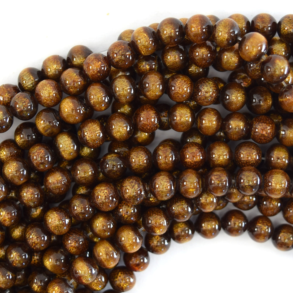 5.5mm - 6mm gold coral round beads 14.5" strand